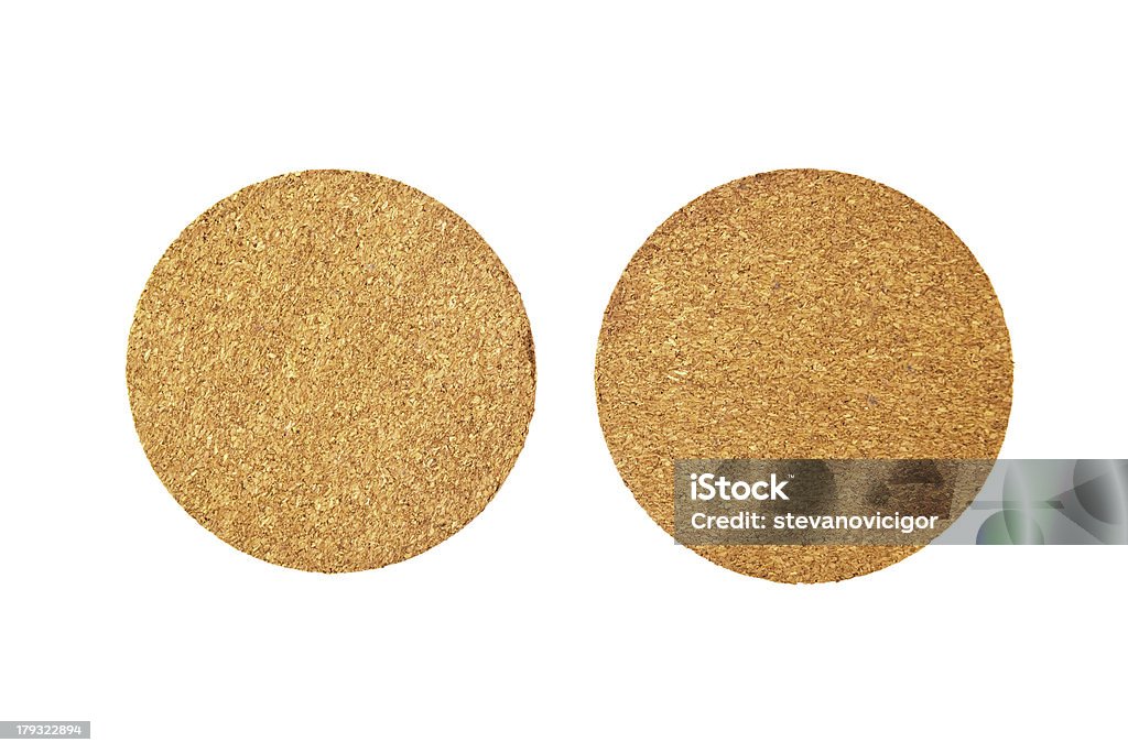Cork coasters Cork coasters. Round cousters over a white background. Brown Stock Photo