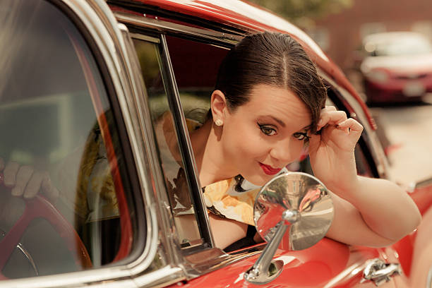 istock Meredith Grace Pin-Up Model Glances in Car Mirror 179323153