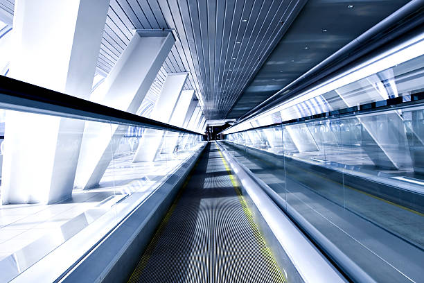 istock moving escalator in airport 179323220