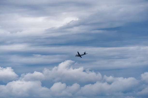 Free Stock Photo of Small Airplane Flying Through Cloudy Sky | Download ...