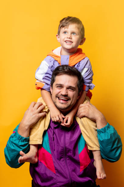 istock Father with son in 80s vintage sport suits 1793236856