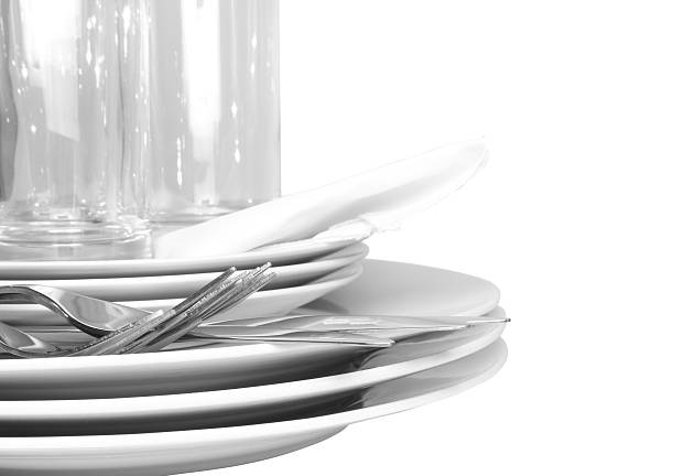 istock Pile of white plates, glasses, forks, spoons. 179324267