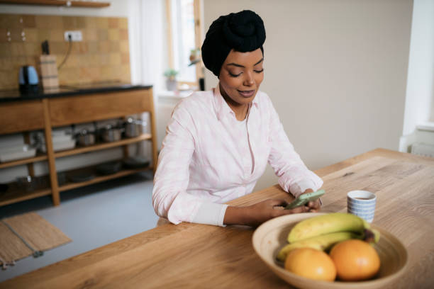 istock A young beautiful woman using a smart phone at home. 1793262614