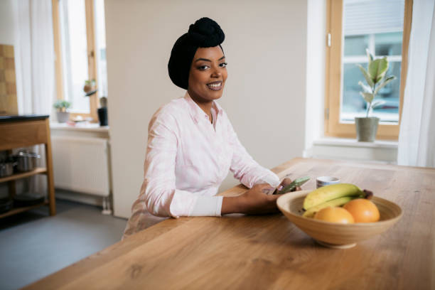 istock A young beautiful woman using a smart phone at home. 1793262619
