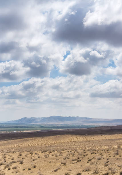 istock Panoramic view of a mountain range in the desert in cloudy summer weather 1793269655