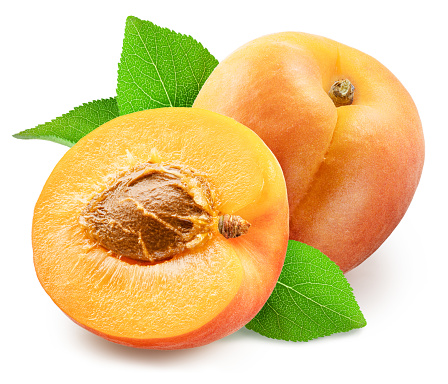 Ripe apricot with leaves and apricot half isolated on white background. File contains clipping path.