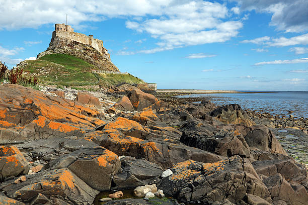 Holy Island of Lindisfarne Lindisfarne castle on the Holy Island, Northumberland, England northumberland stock pictures, royalty-free photos & images