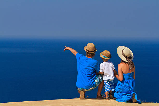 istock family with kid on sea vacation 179330169