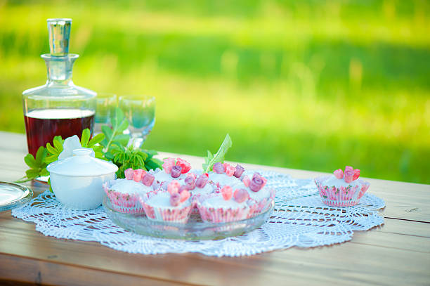 Wine and cupcakes on the table. stock photo