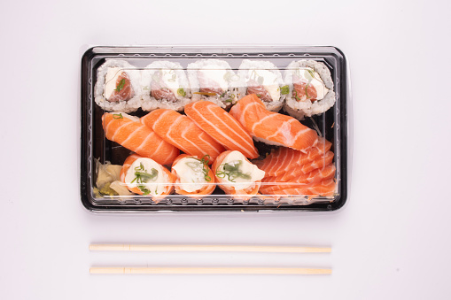 Food delivery - sushi box at home on coronavirus lockdown