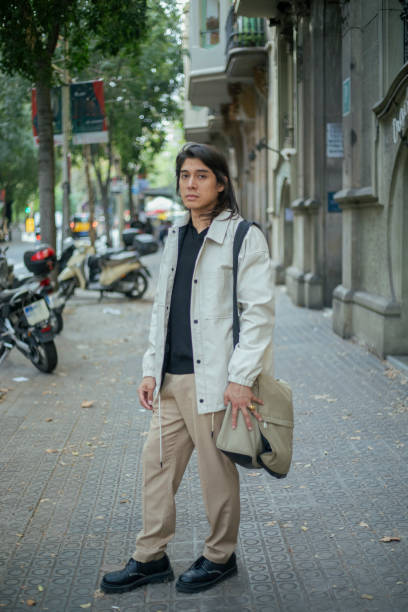 istock Young Latino man walking in the city 1793334793