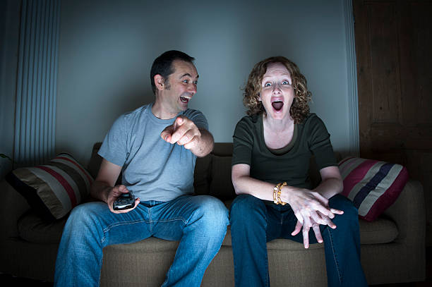 istock couple enjoying watching television together 179333878