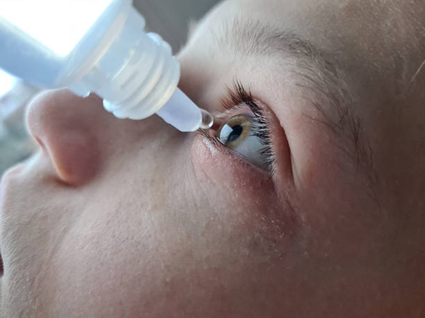 istock Tears and drops dripping into sore eyes 1793341879