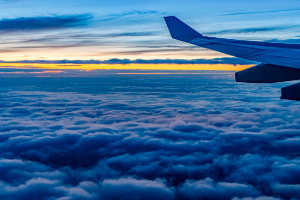 istock Flying above the clouds at dusk 1793381120