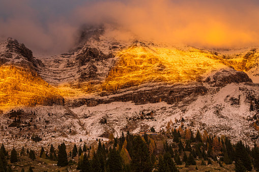 First snow of the 2023-2024 winter season in Sella Nevea. A magical light at sunset.