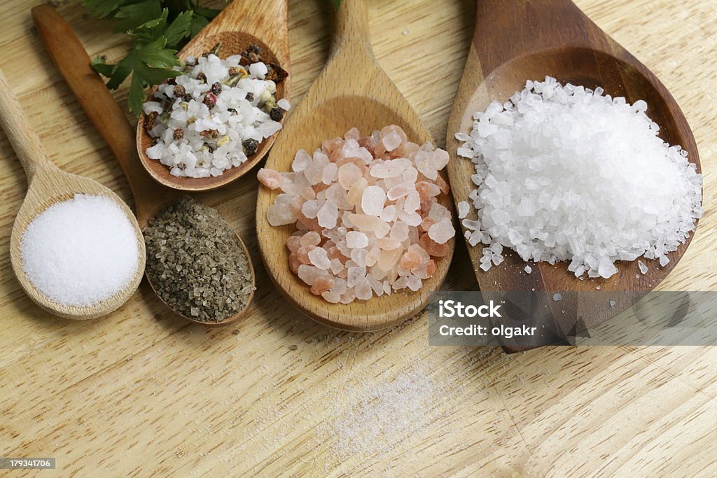 different types of salt (pink, sea, black, and with spices) Salt - Mineral Stock Photo