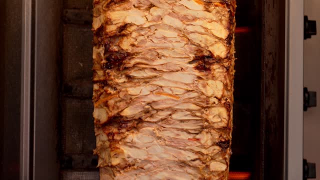 Meat on spit for Shawarma. Grilled meat. Cooking.