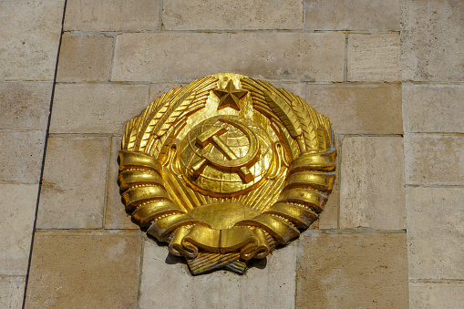Budapest, Hungary, November 3, 2023: State emblem of the former Union of Soviet Socialist Republics depicting a hammer and sickle