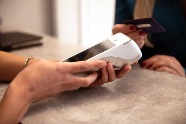 istock Woman paying with credit card 1793425346