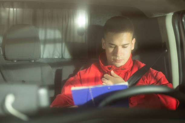 istock Young man driving ambulance paramedic transportation 1793425906