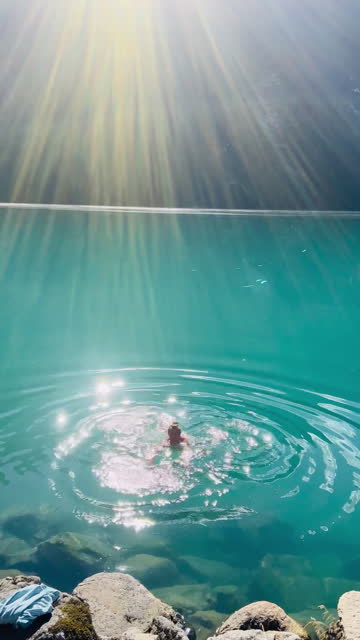 Woman swimming in Norwegian lake