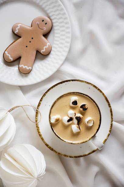 istock cup and mug filled with hot chocolate with ginger man decoration 1793440210