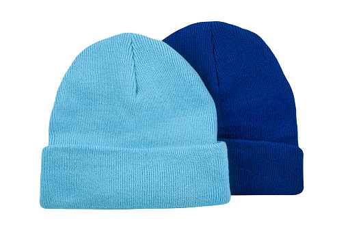 Two various blue woolen caps isolated on white background