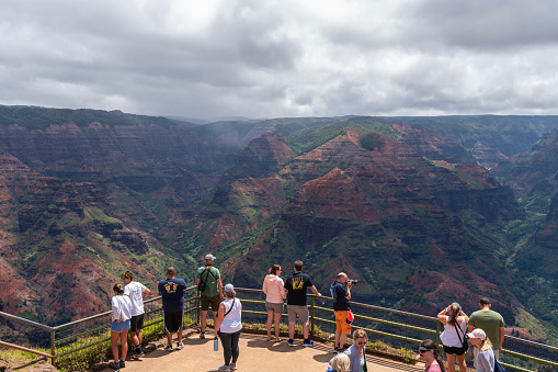 Waimea Canyon, Hawaii June 26, 2023 People enjoying the view at Waimea Canyon Lookout on Kauai, Hawaii, United States.