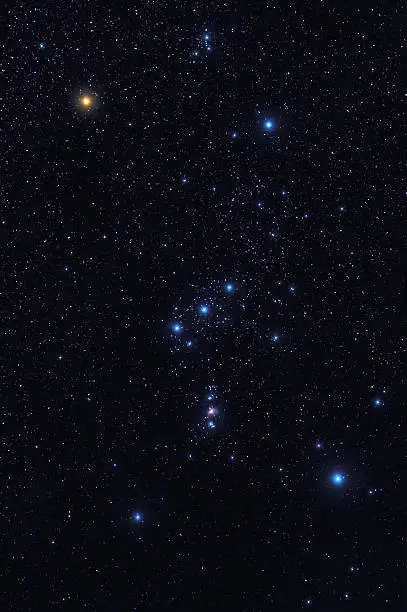 Dark night sky with bright shining stars of Orion constellation