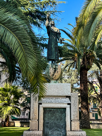 Pompeii, Italy, September 28, 2023: Statue of Saint. Maximilian Maria Kolbe next to the Basilica of Our Lady of the Rosary in Pompeii, Italy.