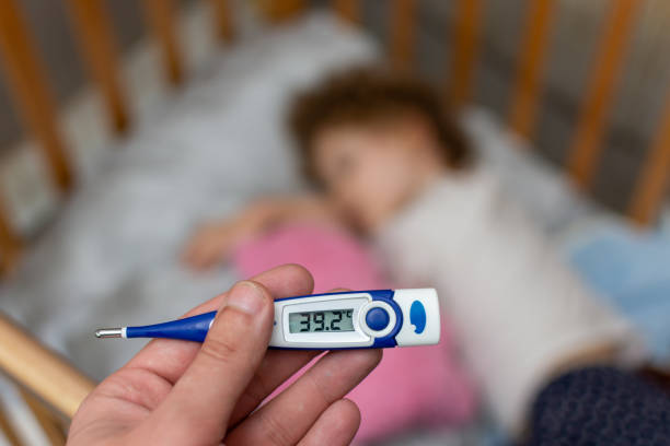The thermometer shows a high temperature in a small child