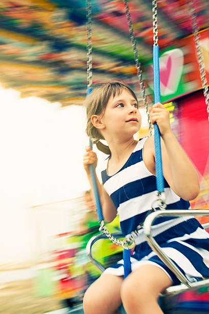 istock Little girl on swing carousel. 179348113