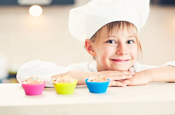 istock Little chef and her cupcakes 179348278