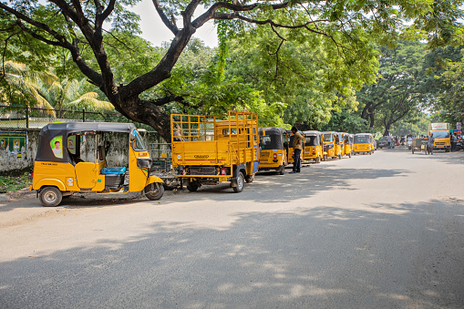 Chennai, India - October 17, 2023. Autorickshaws line up and await passengers in a neighborhood in Chennai.