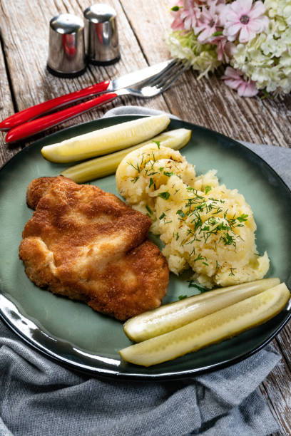 istock Pork chop served with mashed potatoes and pickled cucumber. 1793489847
