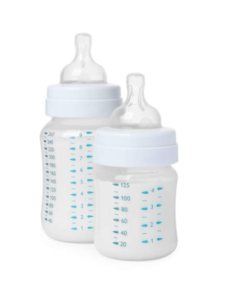 istock Two feeding bottles with infant formula on white background 1793530945