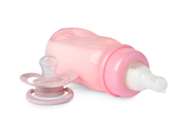 istock One feeding bottle with milk and pacifier on white background 1793531499
