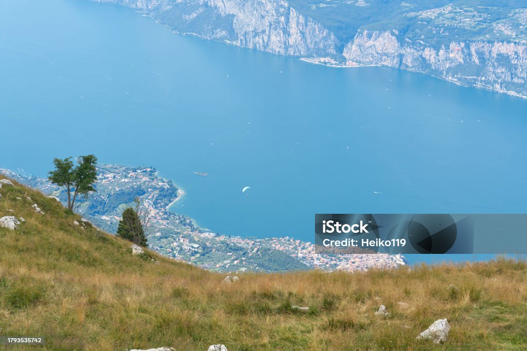 Breathtaking view from the top of Monte Baldo to the blue Lake Garda in Italy Breathtaking view from the summit of Monte Baldo to the blue waters of Lake Garda near Malcesine in Italy Aerial View Stock Photo