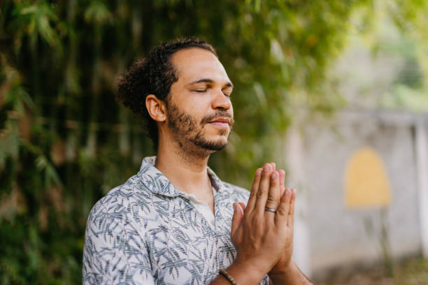 istock Man meditating in the backyard 1793546386