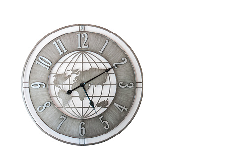 Wall clock in the shape of a world map in gray color isolated on a white background
