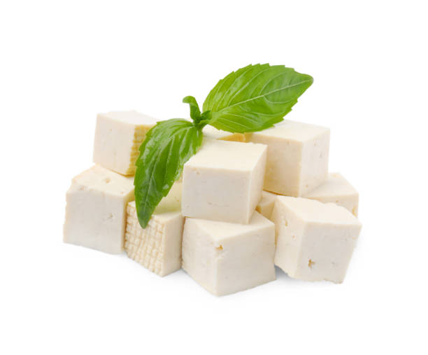 istock Delicious tofu cheese and basil isolated on white 1793563013