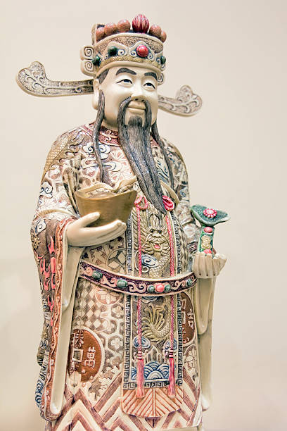 istock Prosperity Money God Ivory Carving Closeup 179357834