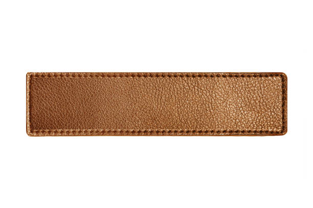 brown leather belt strap closeup isolated on white. brown titched leather seam frame label tag isolated on white. empty copy space fashion background. - leather patch label stitch imagens e fotografias de stock