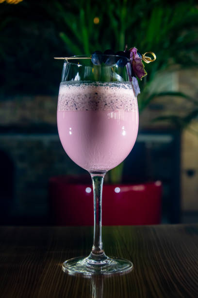istock Home made Fresh Smoothies with black currants and blueberries in a glass with ingredients on the background 1793603202