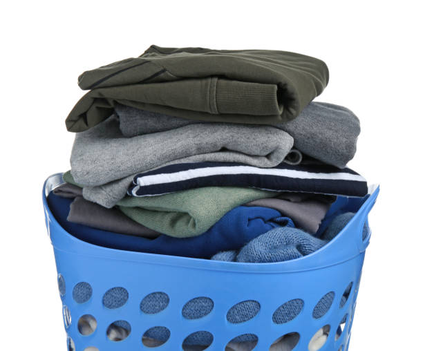 istock Plastic laundry basket with clean clothes isolated on white 1793609587