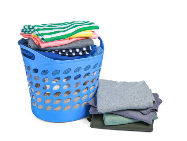 istock Plastic laundry basket and clean clothes isolated on white 1793610640
