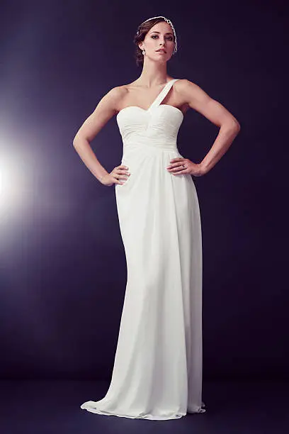 Portrait of glamorous young woman in white ballgown