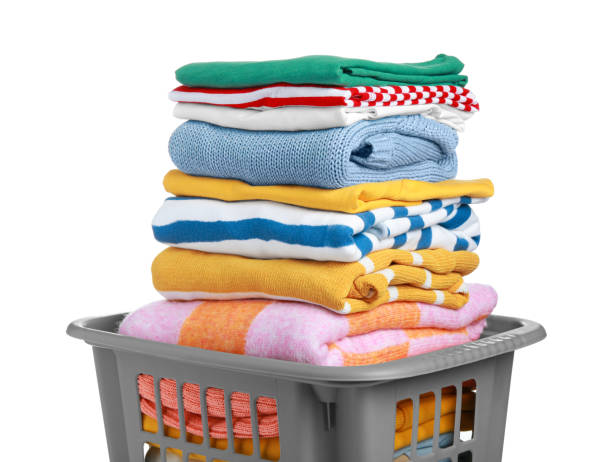 istock Plastic laundry basket with clean clothes isolated on white 1793611700