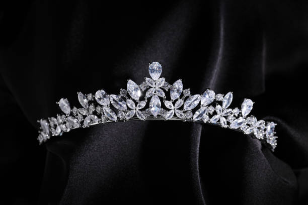 istock Beautiful silver tiara with diamonds on black cloth 1793616361