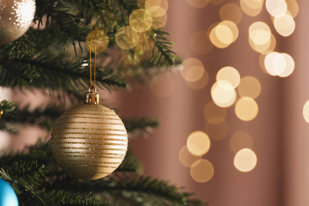 istock Christmas tree with beautiful baubles on blurred background, closeup. Space for text 1793616377